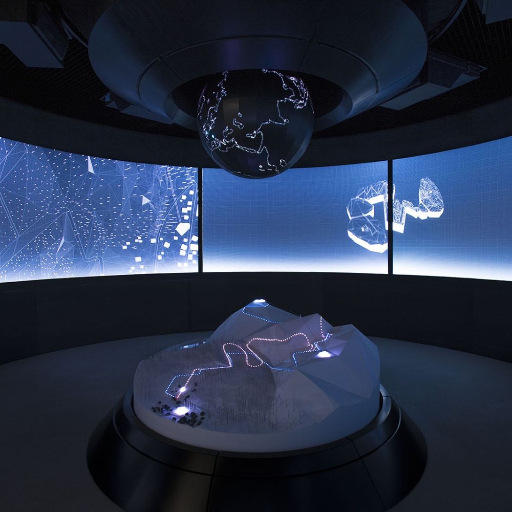Photo of 007 Elements in Solden Austria. Image shows the inside of the installation with big blue video screen walls.