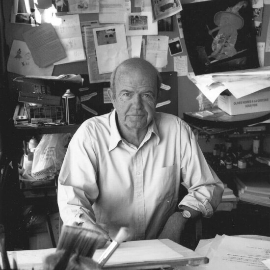 Black and white photograph of illustrator John Burningham, a middle aged white man.