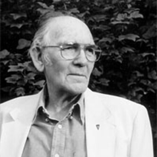 Black and white photograph of author John Gardner, an older white man wearing glasses.