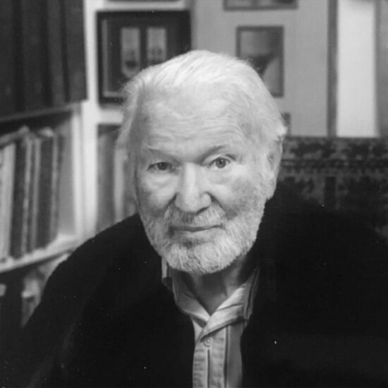 Black and white photograph of author John Pearson, an older white man with a beard.