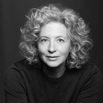 Black and white photograph of author Samantha Weinberg, a middle aged white woman with curly blonde hair.