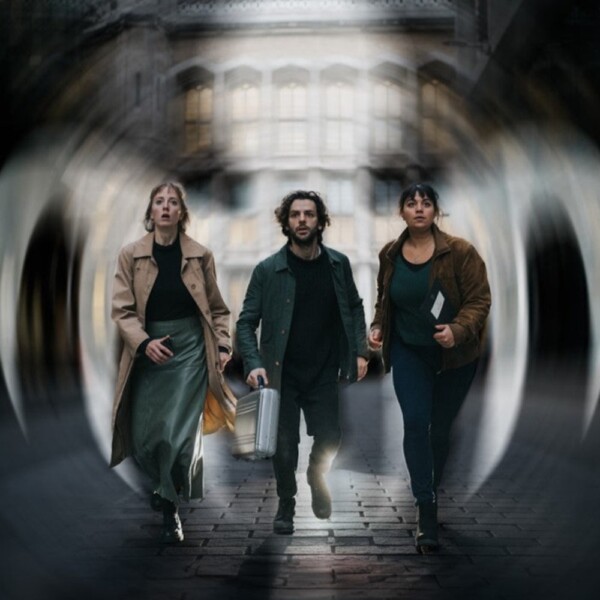 A picture of three game players in the middle of London playing the Hidden City x James Bond adventure game, Shadow of SPECTRE