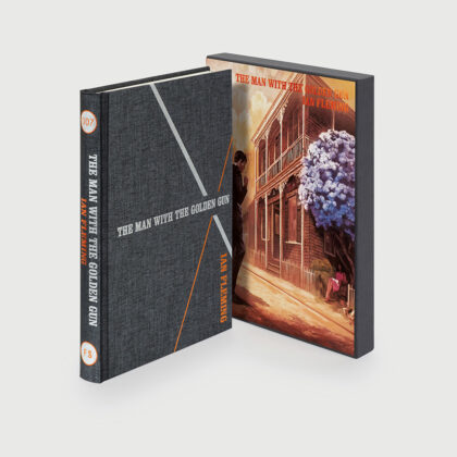 Image of the Folio society hardback edition of the man with the golden gun by Ian Fleming, pictured with the slipcase illustrated by Fay Dalton.