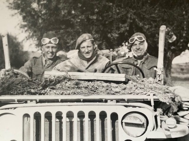 Black and white photograph of Royal Marines in a Jeep, taken in France in 1944